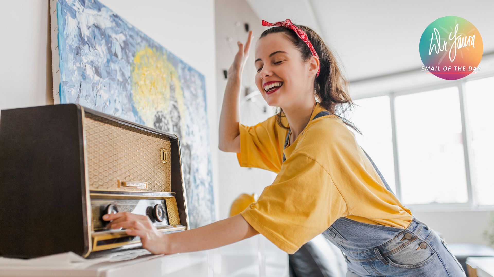 Woman in yellow shirt and denim overalls turns dial on vintage radio