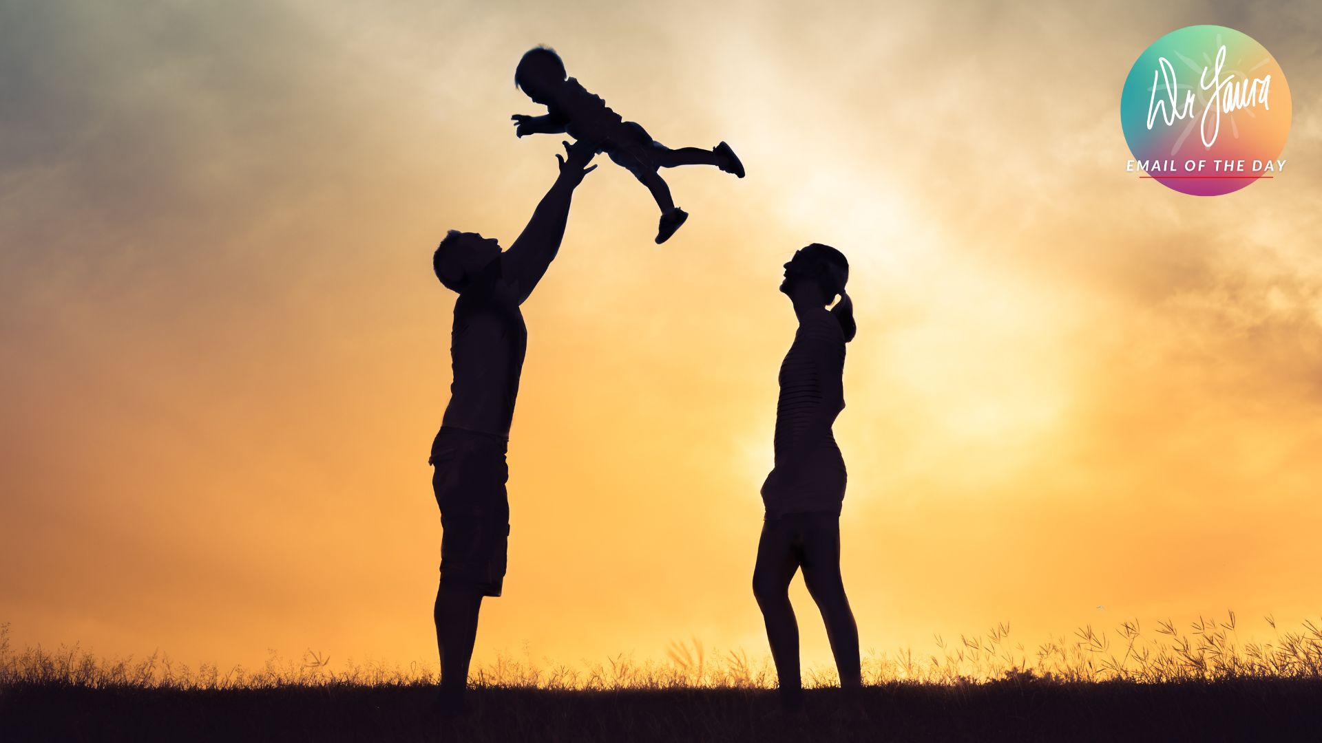Silhouette of man tossing child into the air while female silhouette looks at them