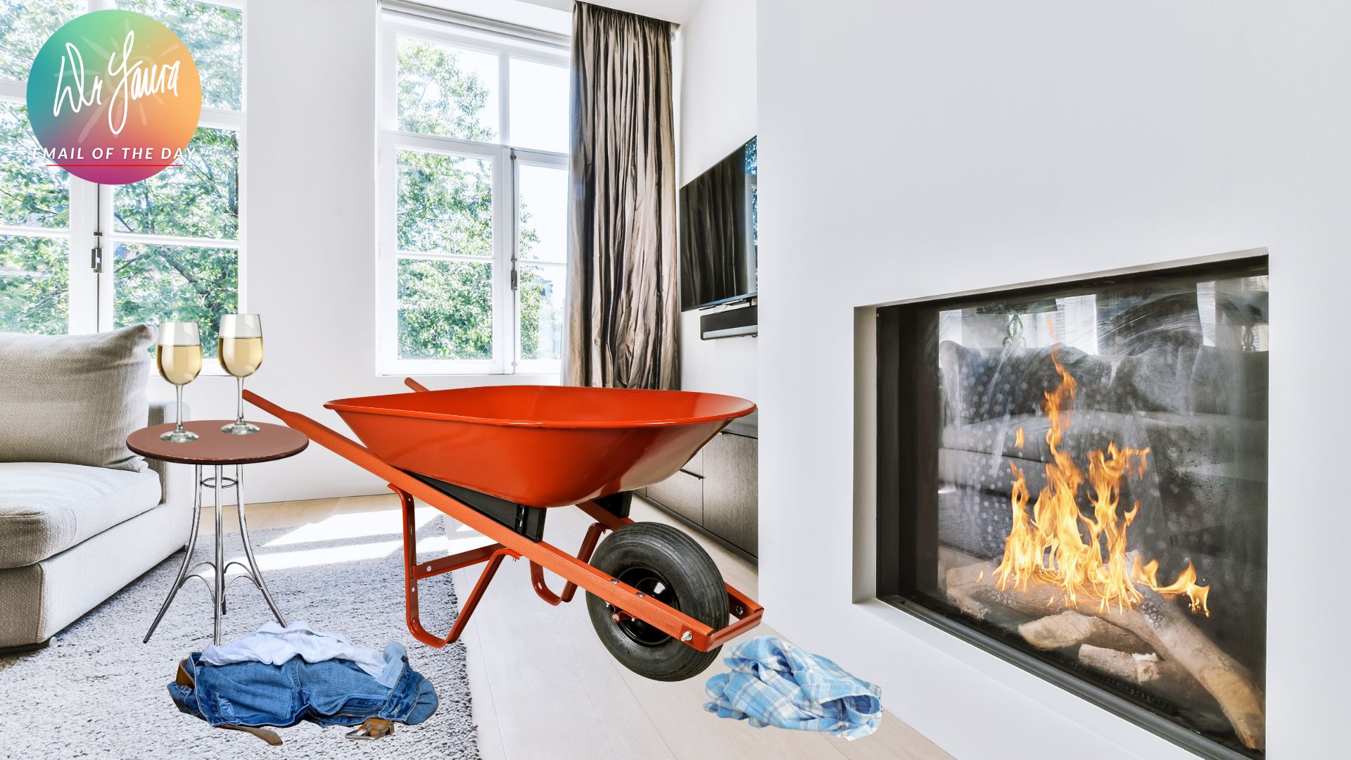 Red wheelbarrow sits in a living room with several articles of clothing lay on the ground