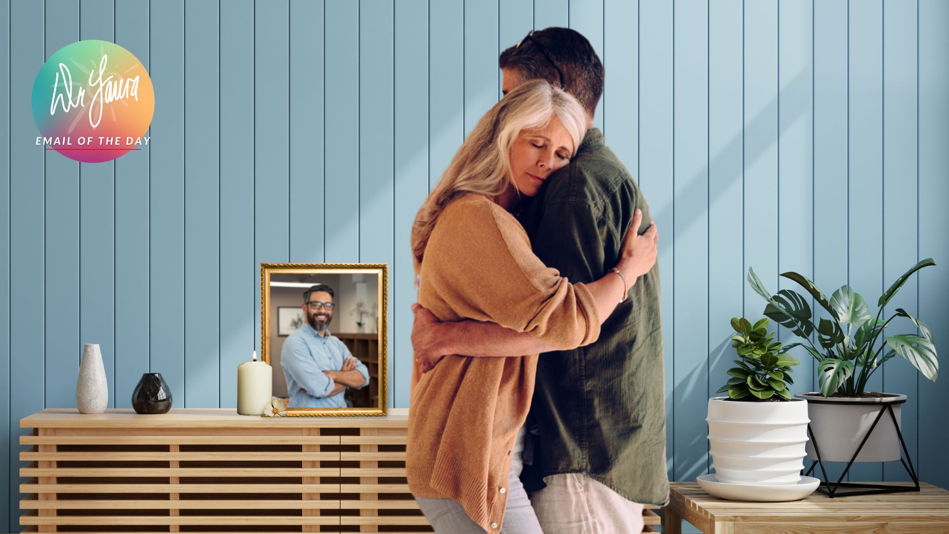 Woman embraces man while framed image of man sits on console center