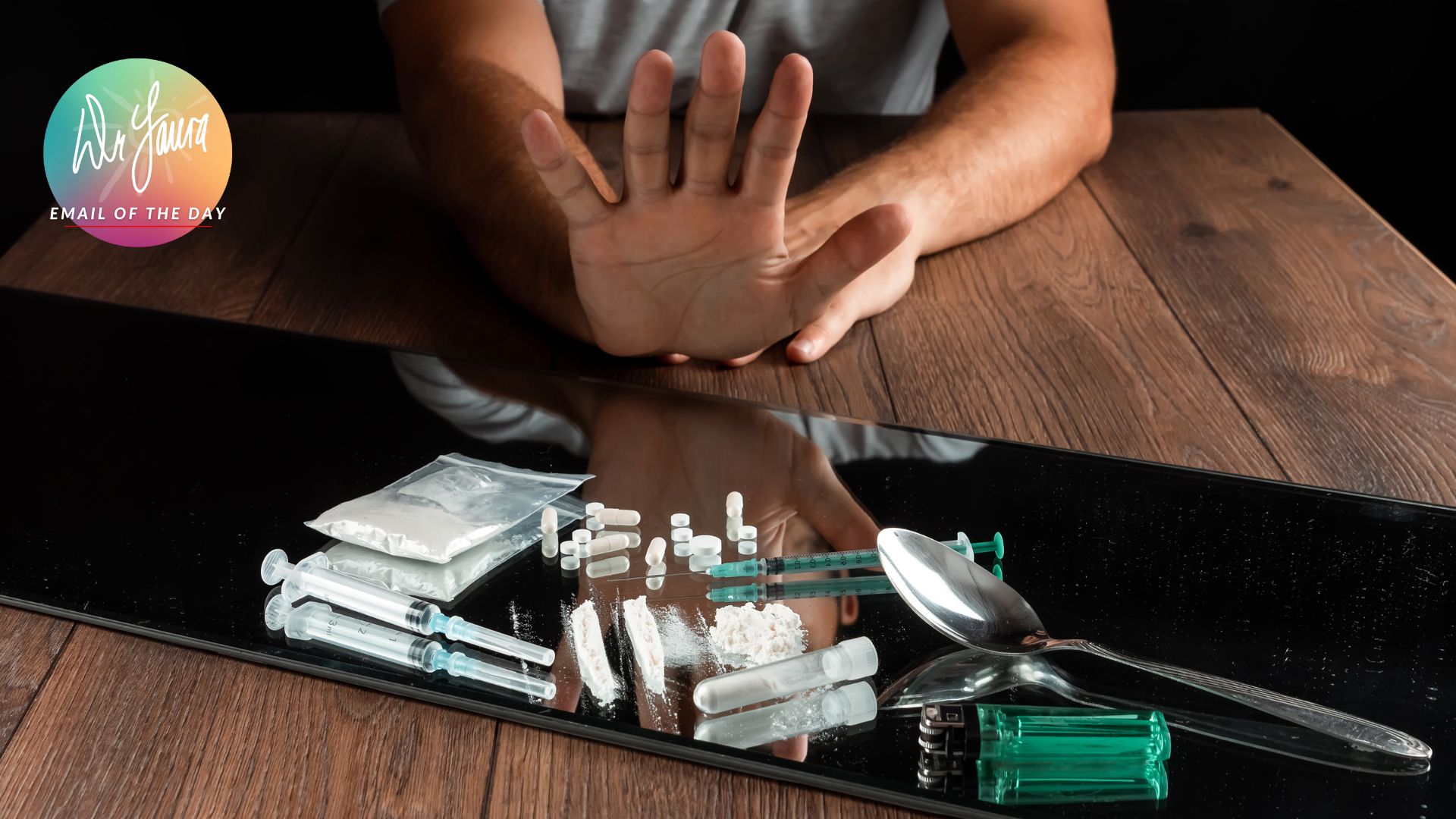 An open hand rejects a tray of drugs