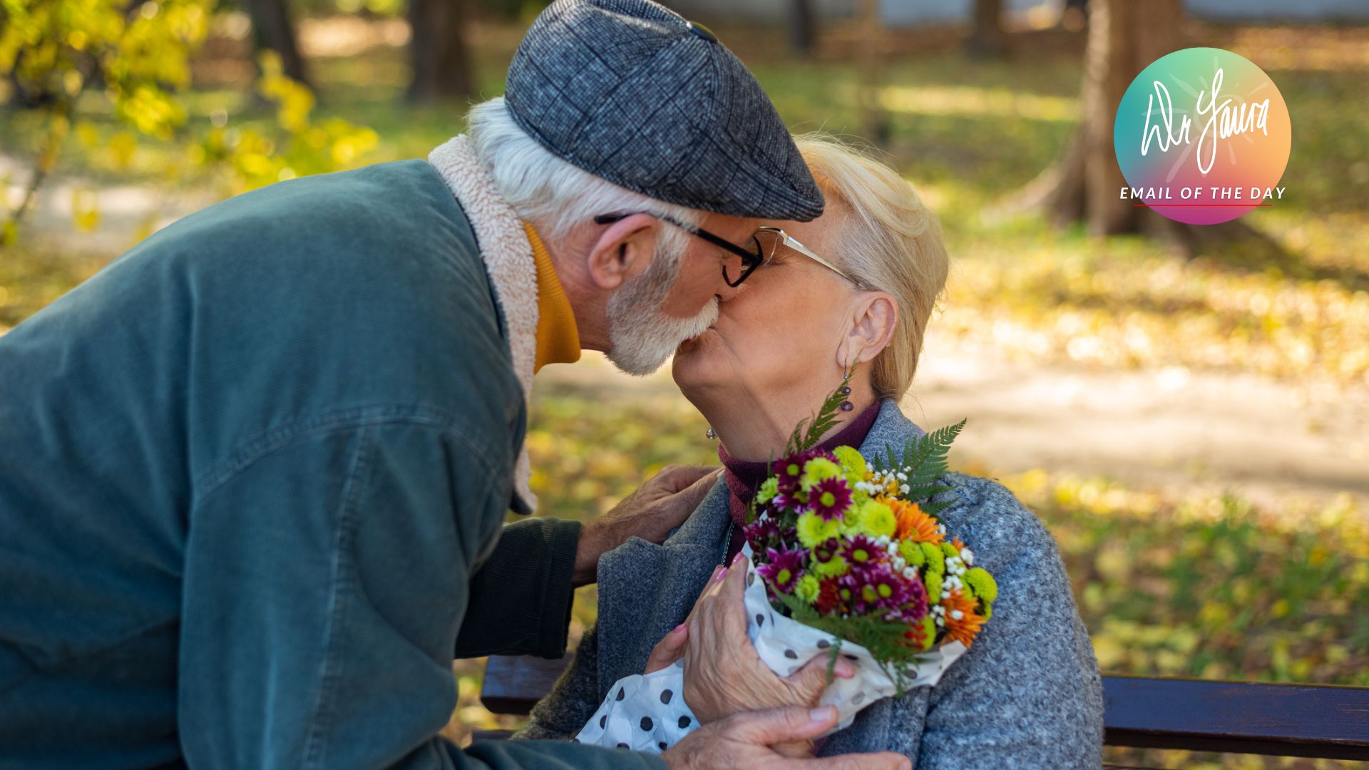 Woman holds onto flowers while kissing standing man