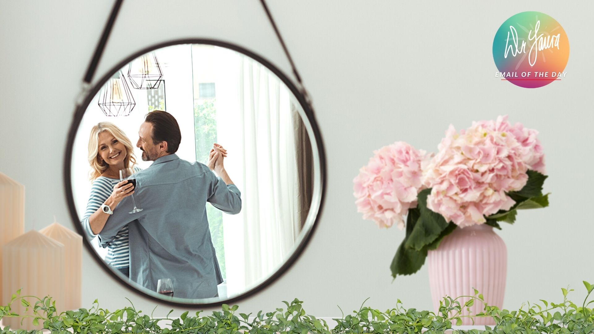 Mirror on wall reflects man dancing with woman who is smiling