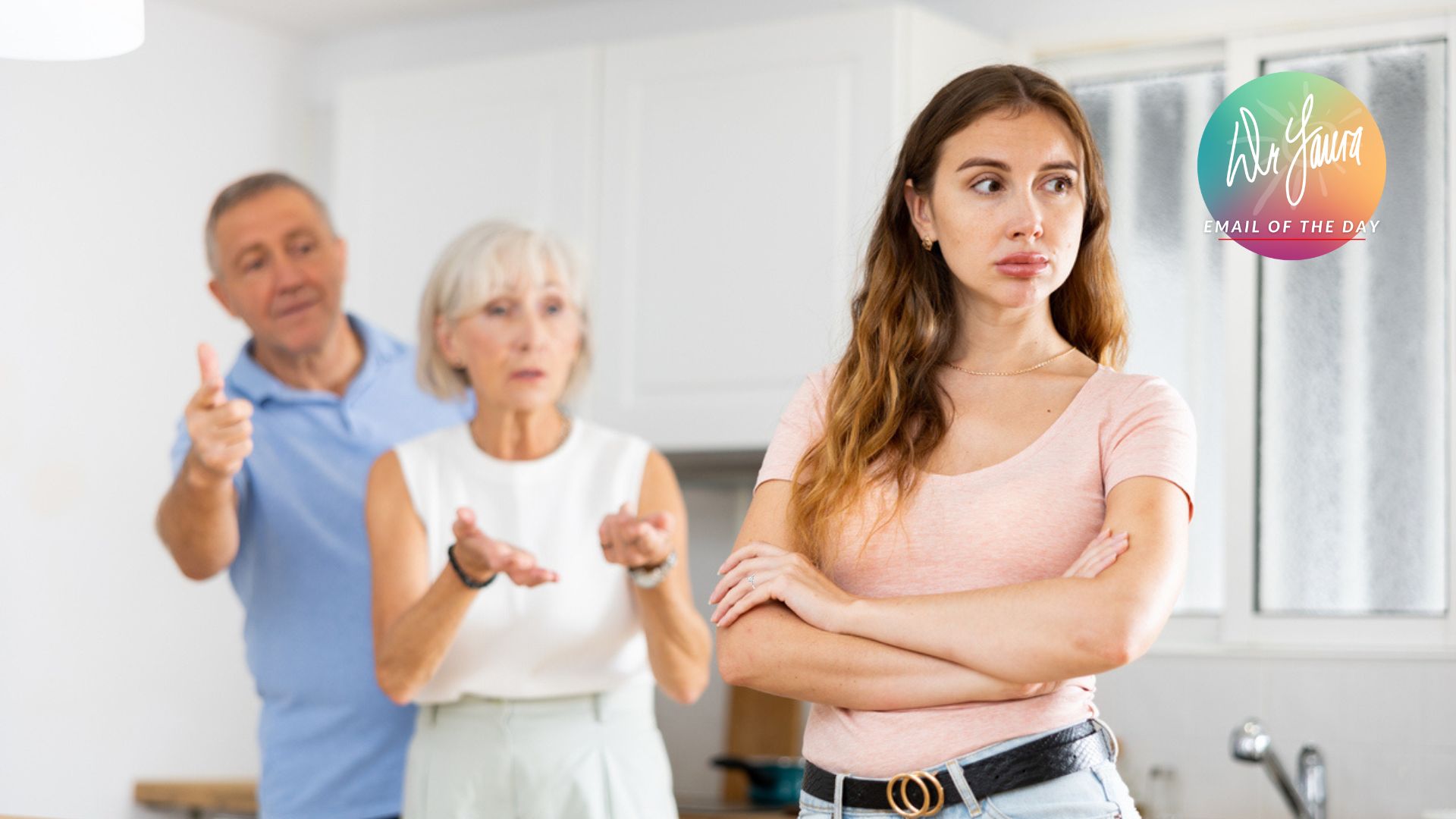 Young woman crosses her arms while looking away from older woman and older man behind her, both talking to her