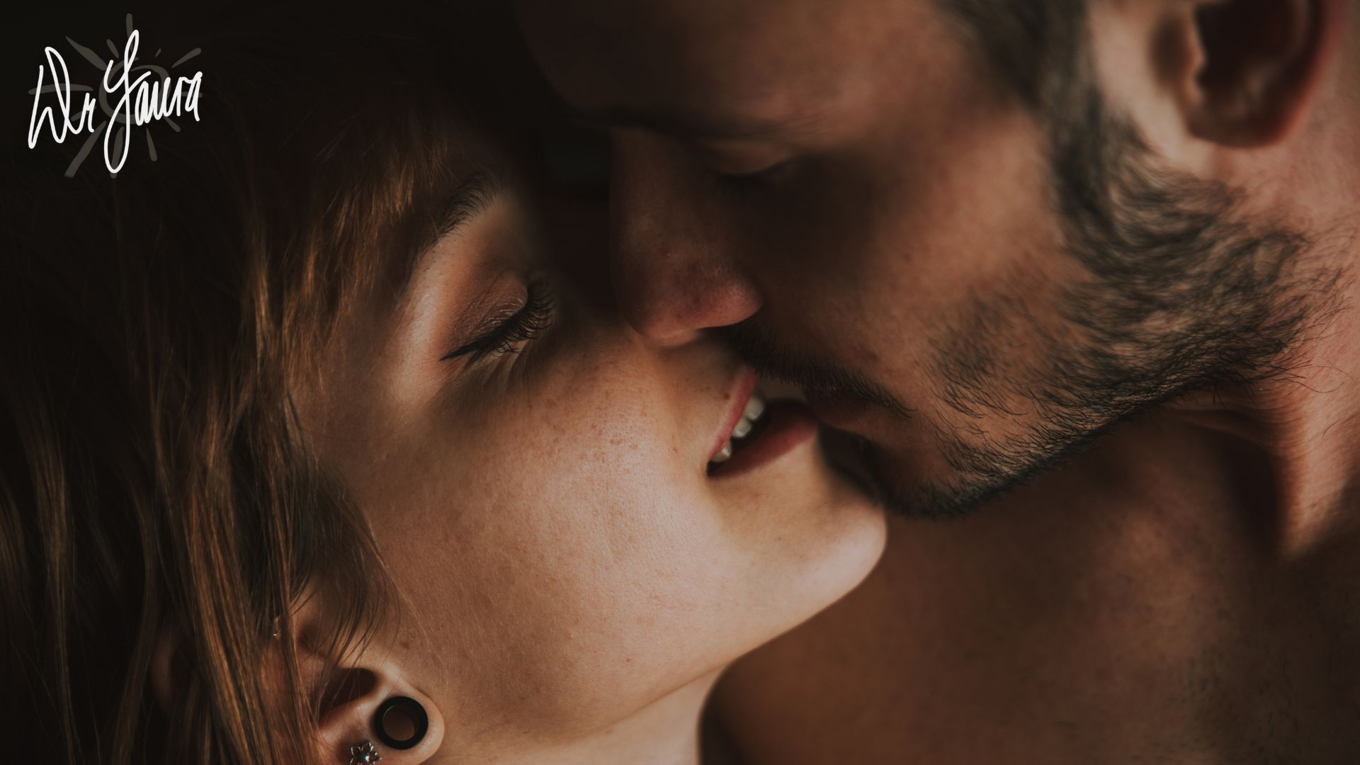 Woman with closed eyes kisses man with closed eyes