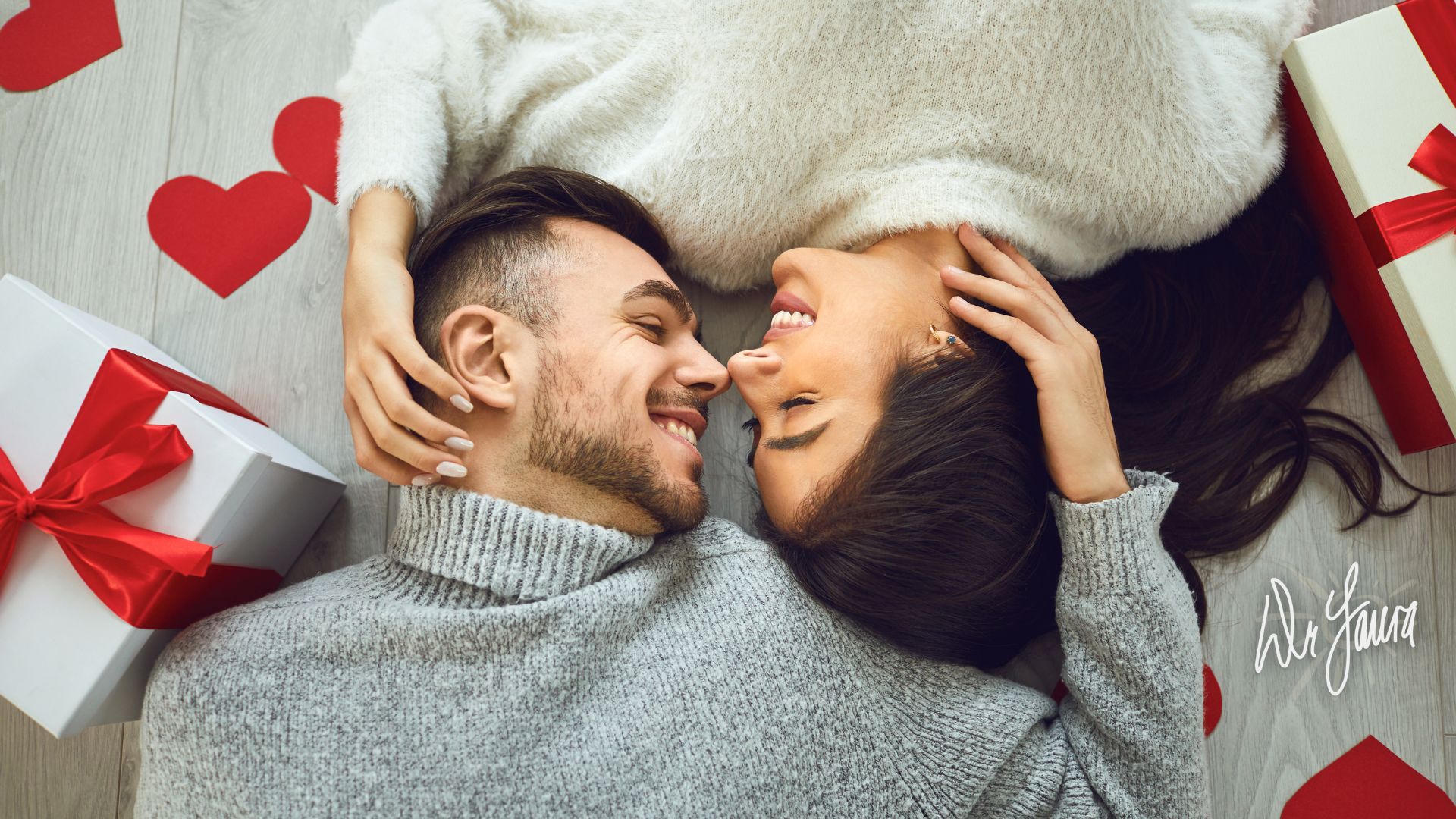 Woman and man lie next to each other and looking at one another